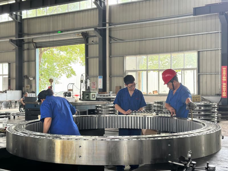 Precision in Motion: Loading Steel Balls into Our 2-Meter Slewing Bearing for Truck-Mounted Cranes