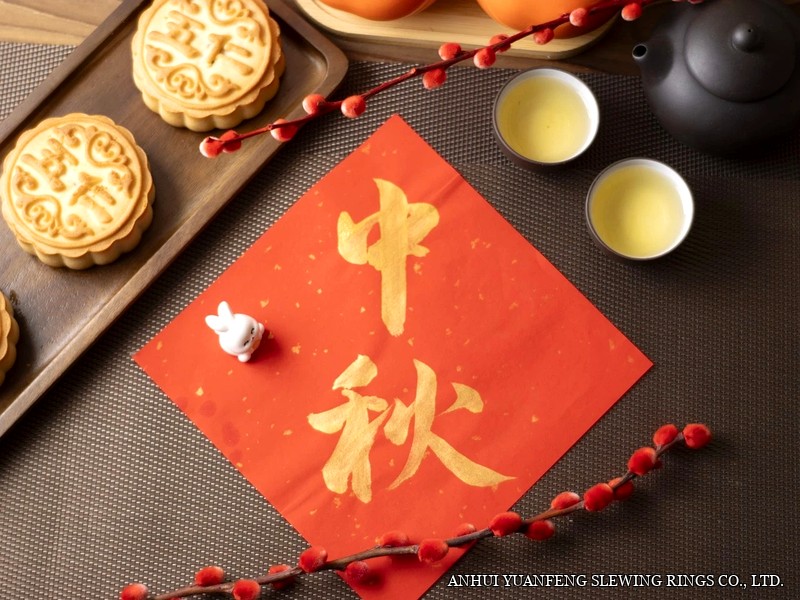 Mid-Autumn Festival calligraphy on red paper with mooncakes, tea and lanterns
